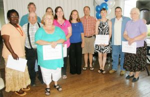 Mid Shore foster parents were honored at an appreciation dinner at the Kent Island Yacht Club in Chester.Pictured back row, left to right, are Queen Anne’s County foster parents Joyce Jones, Earl and Nancy Leager, Craig and Tami Dilling, Dawn Lange, Gwen and David Boyle, Sharon and David Quinn, and Daisy Combs.